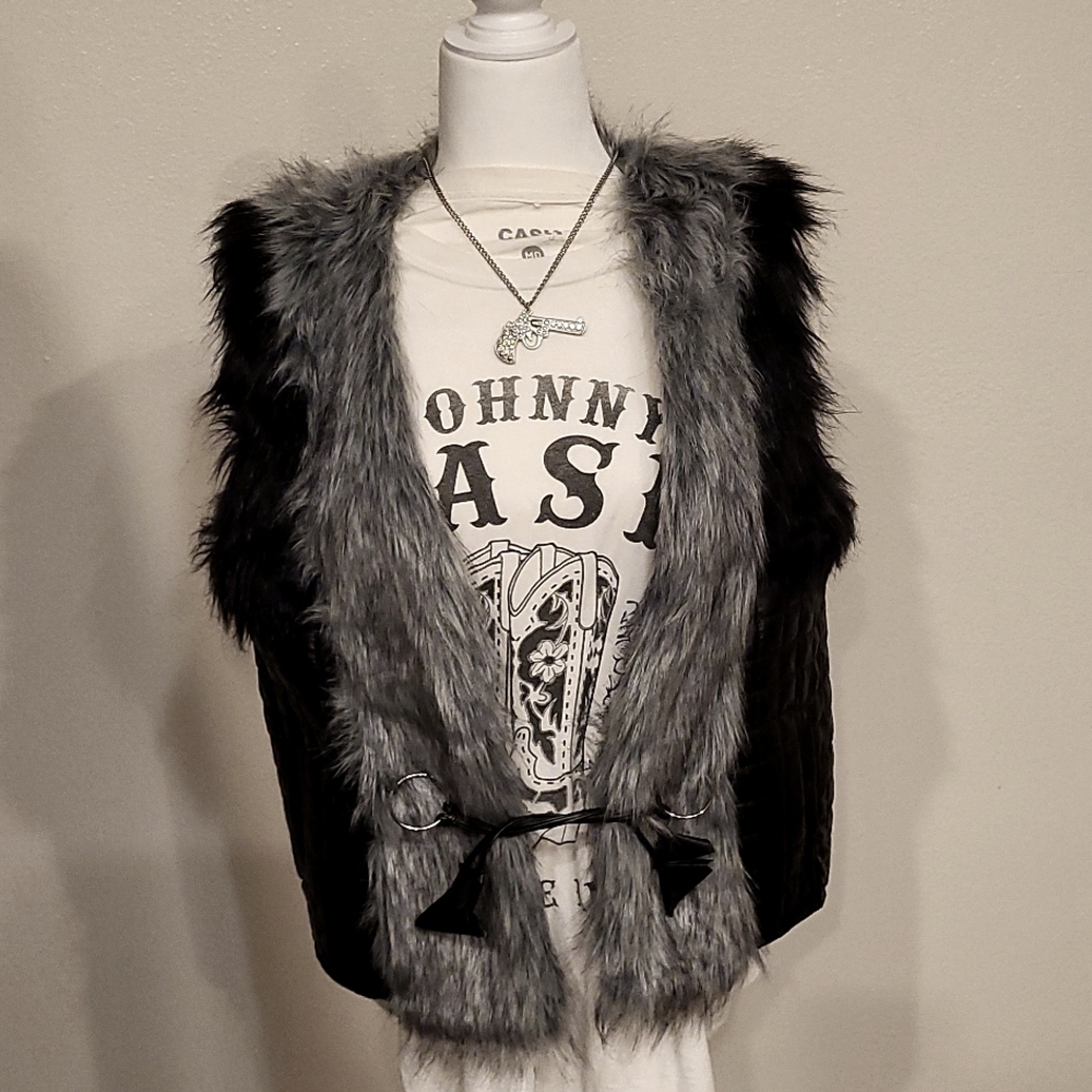 Black and silver vest with leather strap ties in front faux fur across front